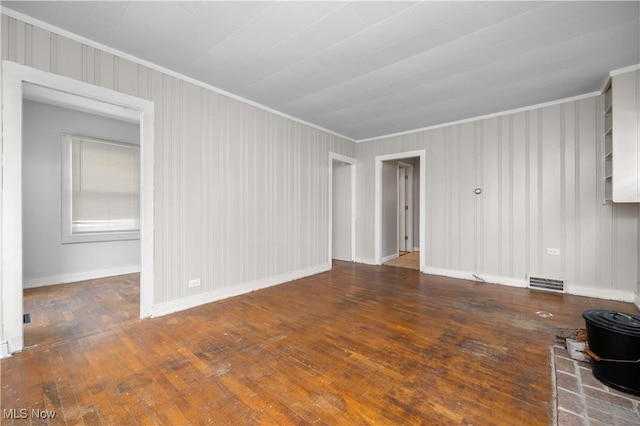 348 Elberta Dr, Vermilion, OH 44089 - spare room featuring ornamental molding, wood-type flooring, and baseboards