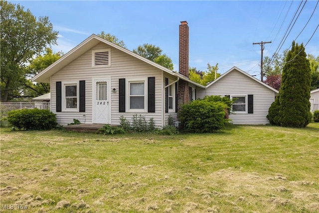 348 Elberta Dr, Vermilion, OH 44089 - view of front facade featuring a chimney