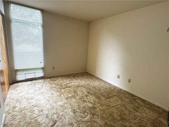 2540 N River Rd NE Unit C7, Warren, OH 44483 - spare room with carpet floors and baseboards