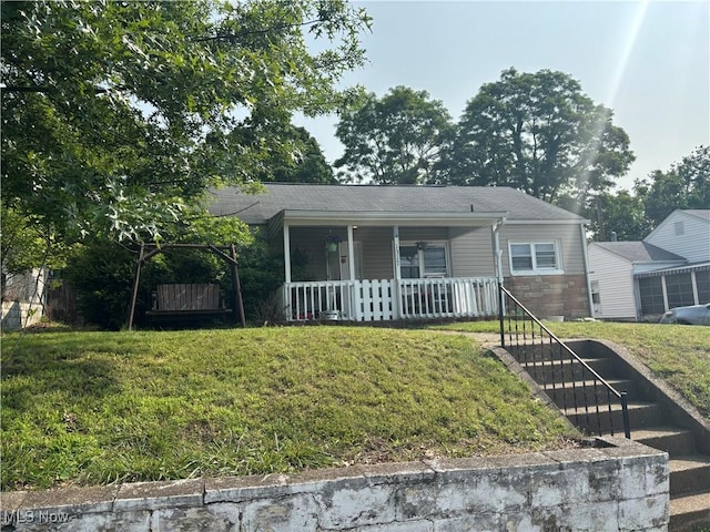 1317 40th St, Parkersburg, WV 26104 - view of front of home featuring covered porch and a front yard