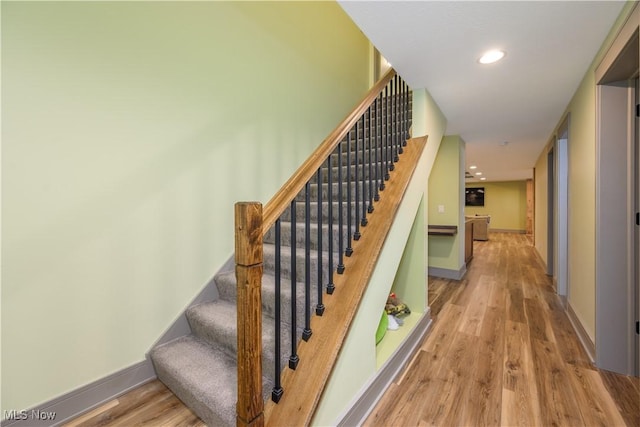 4340 Castlegate Blvd, Uniontown, OH 44685 - staircase featuring wood finished floors, baseboards, and recessed lighting