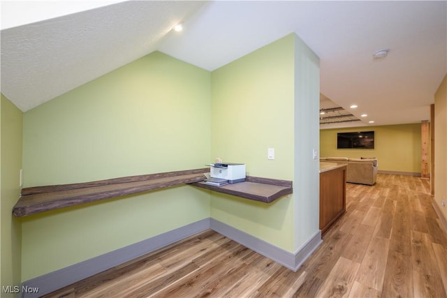 4340 Castlegate Blvd, Uniontown, OH 44685 - corridor with light wood-style floors, baseboards, vaulted ceiling, recessed lighting, and an office area