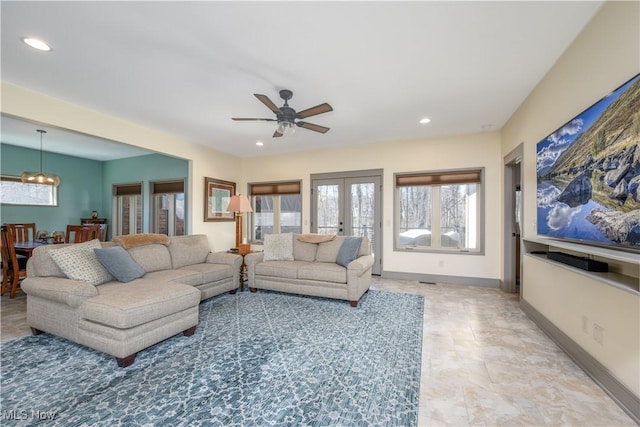 4340 Castlegate Blvd, Uniontown, OH 44685 - living room with recessed lighting, ceiling fan, french doors, and baseboards