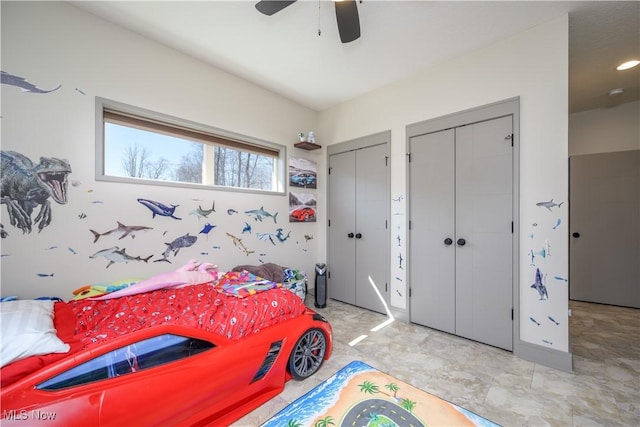 4340 Castlegate Blvd, Uniontown, OH 44685 - bedroom with two closets and ceiling fan