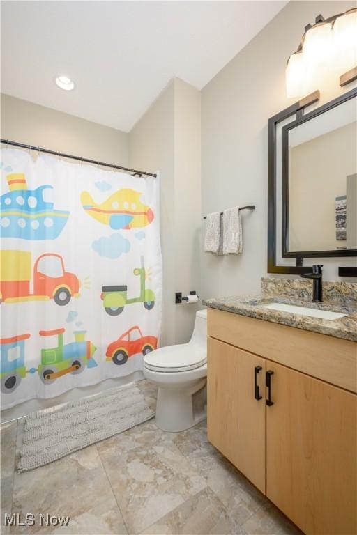 4340 Castlegate Blvd, Uniontown, OH 44685 - full bath with toilet, vanity, marble finish floors, and curtained shower