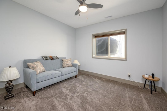 4340 Castlegate Blvd, Uniontown, OH 44685 - living area featuring carpet, ceiling fan, and baseboards