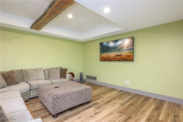 4340 Castlegate Blvd, Uniontown, OH 44685 - living area featuring baseboards, recessed lighting, a tray ceiling, and light wood-style flooring