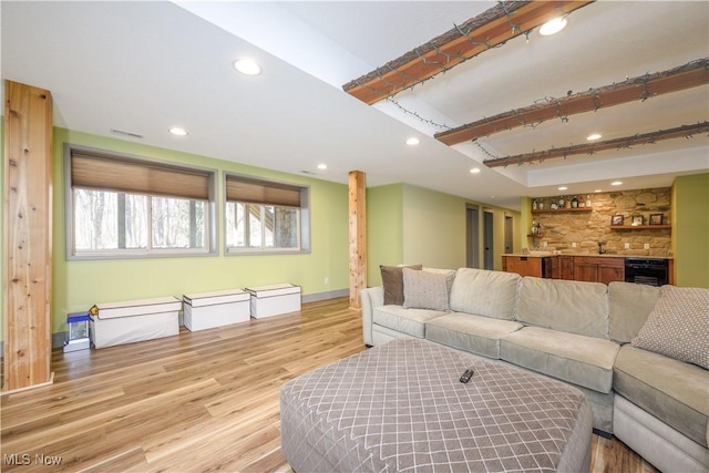4340 Castlegate Blvd, Uniontown, OH 44685 - living room featuring recessed lighting, light wood-style flooring, healthy amount of natural light, bar area, and baseboards