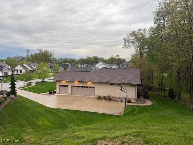 4340 Castlegate Blvd, Uniontown, OH 44685 - view of property exterior featuring a yard, driveway, and a residential view