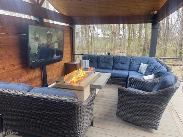 4340 Castlegate Blvd, Uniontown, OH 44685 - deck with an outdoor living space with a fire pit