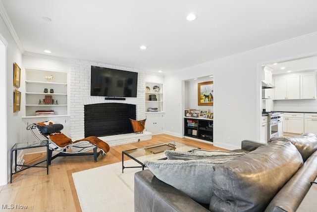 19 Brandywood Dr, Pepper Pike, OH 44124 - living area with crown molding, light wood-style flooring, recessed lighting, built in features, and a brick fireplace