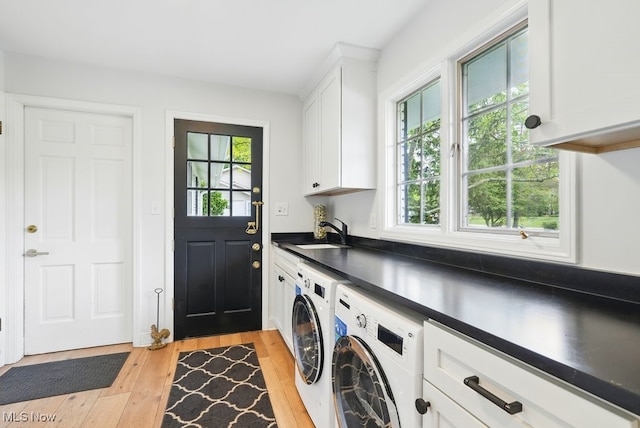19 Brandywood Dr, Pepper Pike, OH 44124 - laundry area with washing machine and clothes dryer, cabinet space, plenty of natural light, and light wood-type flooring