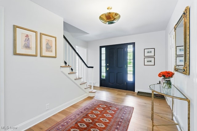 19 Brandywood Dr, Pepper Pike, OH 44124 - foyer entrance with wood finished floors, stairs, and baseboards