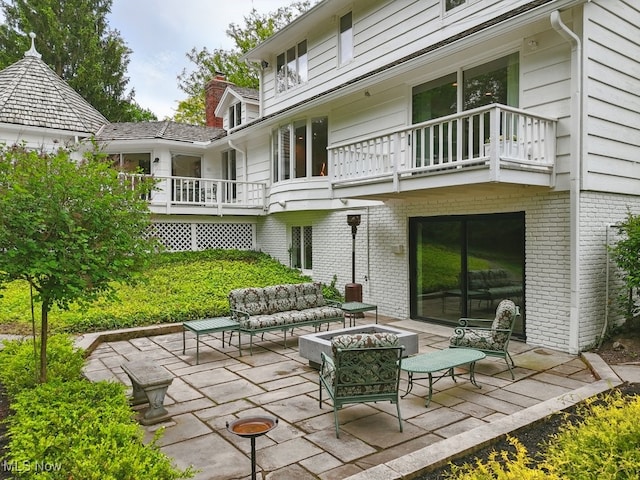 19 Brandywood Dr, Pepper Pike, OH 44124 - view of patio featuring a balcony and an outdoor living space with a fire pit