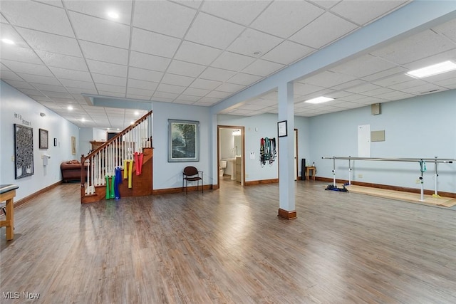 5495 Meese Rd NE, Louisville, OH 44641 - exercise room with wood finished floors, baseboards, and a drop ceiling