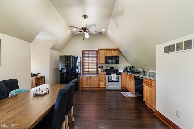 5495 Meese Rd NE, Louisville, OH 44641 - kitchen featuring black appliances, ceiling fan, dark wood-style floors, brown cabinets, and vaulted ceiling