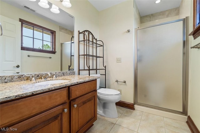 5495 Meese Rd NE, Louisville, OH 44641 - bathroom with tile patterned flooring, a stall shower, vanity, toilet, and baseboards