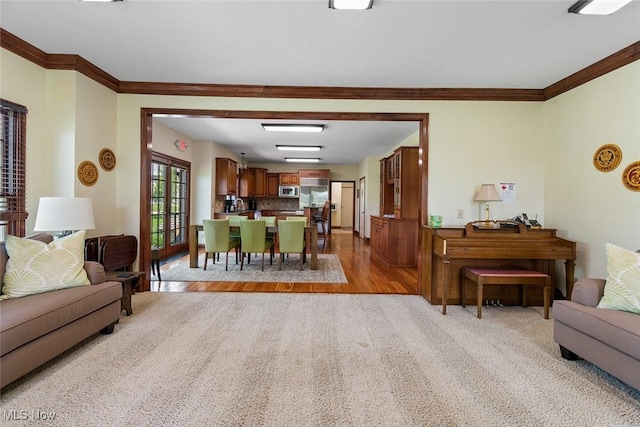 5495 Meese Rd NE, Louisville, OH 44641 - living room with crown molding and light carpet