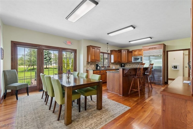 5495 Meese Rd NE, Louisville, OH 44641 - dining room featuring light wood-style floors