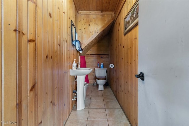 5495 Meese Rd NE, Louisville, OH 44641 - half bath with wooden walls, toilet, tile patterned floors, and wooden ceiling