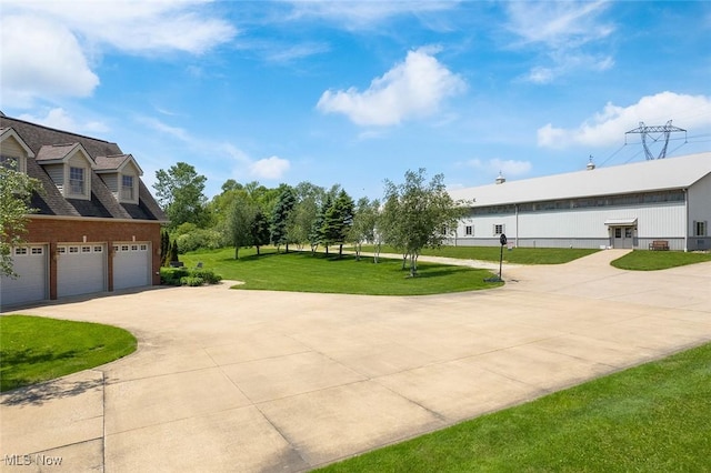 5495 Meese Rd NE, Louisville, OH 44641 - view of side of property featuring concrete driveway and a yard