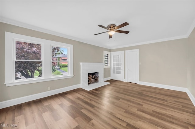 3528 Daleford Rd, Shaker Heights, OH 44120 - unfurnished living room featuring crown molding, ceiling fan, baseboards, wood finished floors, and a brick fireplace