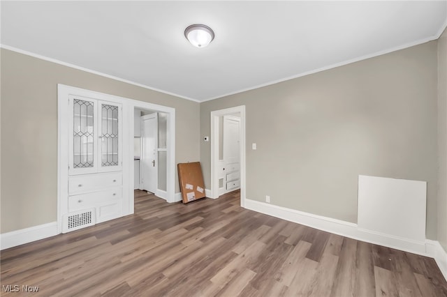 3528 Daleford Rd, Shaker Heights, OH 44120 - unfurnished bedroom with wood finished floors, baseboards, and ornamental molding