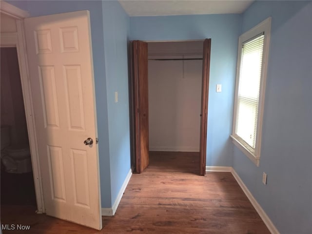 332 Stull Ave, Akron, OH 44312 - unfurnished bedroom featuring wood finished floors, a closet, and baseboards