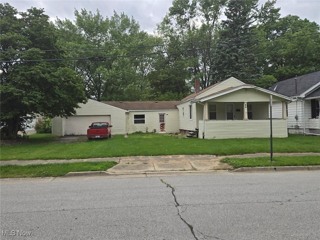 332 Stull Ave, Akron, OH 44312 - view of front of house with a front yard and a detached garage
