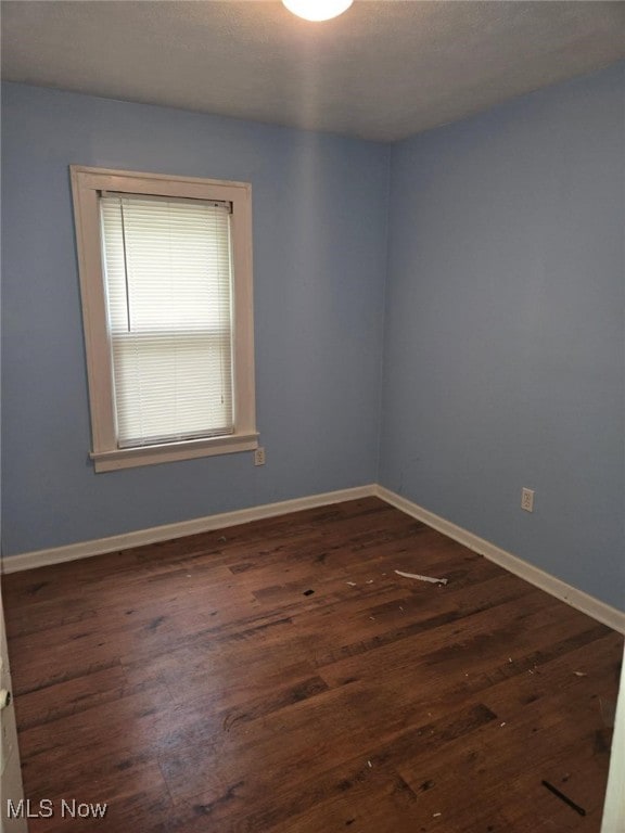 332 Stull Ave, Akron, OH 44312 - spare room featuring wood finished floors and baseboards