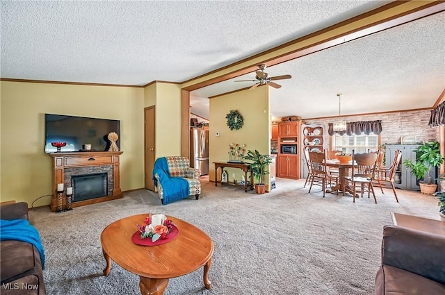 1270 S Lincoln Ave Unit A, Salem, OH 44460 - living area featuring a textured ceiling, light carpet, ceiling fan, a fireplace, and crown molding