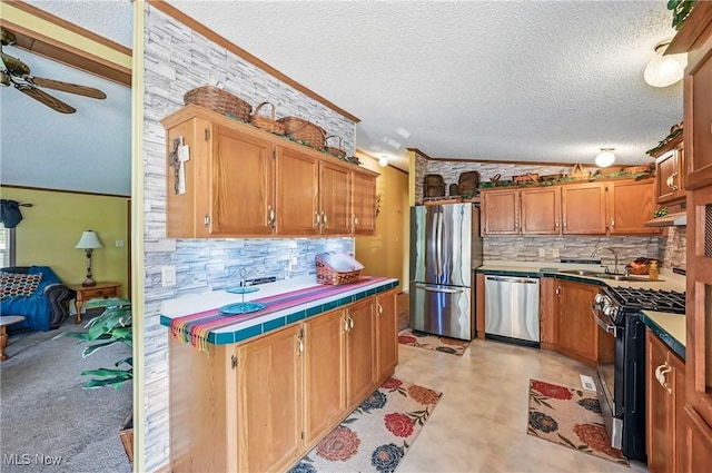1270 S Lincoln Ave Unit A, Salem, OH 44460 - kitchen with stainless steel appliances, tile counters, backsplash, a ceiling fan, and a textured ceiling