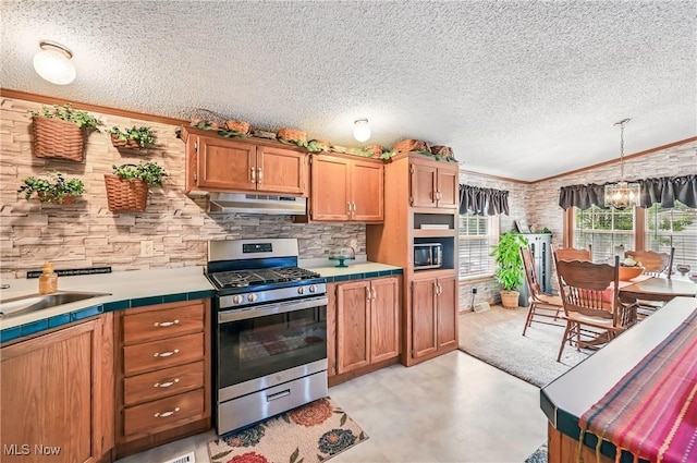 1270 S Lincoln Ave Unit A, Salem, OH 44460 - kitchen with gas range, under cabinet range hood, tile counters, light floors, and a textured ceiling