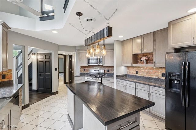 322 N Bayshore Dr Unit 3, Columbiana, OH 44408 - kitchen with appliances with stainless steel finishes, light tile patterned floors, backsplash, recessed lighting, and a center island