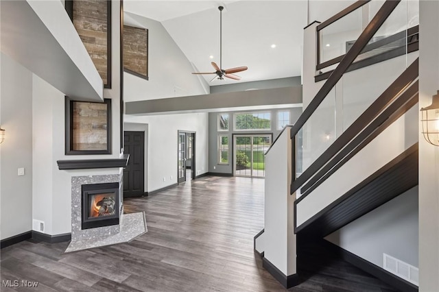 322 N Bayshore Dr Unit 3, Columbiana, OH 44408 - unfurnished living room with high vaulted ceiling, baseboards, ceiling fan, a fireplace, and recessed lighting