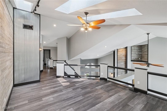 322 N Bayshore Dr Unit 3, Columbiana, OH 44408 - spare room featuring a skylight, ceiling fan, wood finished floors, high vaulted ceiling, and track lighting