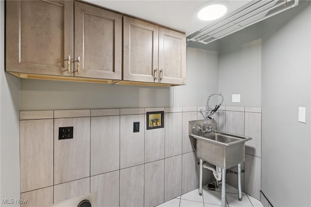 322 N Bayshore Dr Unit 3, Columbiana, OH 44408 - laundry room with cabinet space, tile patterned floors, tile walls, and hookup for a washing machine