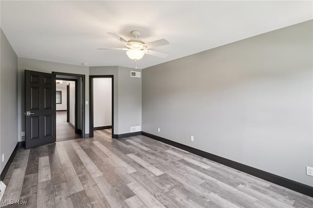 322 N Bayshore Dr Unit 3, Columbiana, OH 44408 - unfurnished room with ceiling fan, baseboards, and wood finished floors