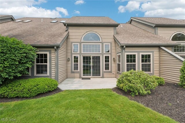 322 N Bayshore Dr Unit 3, Columbiana, OH 44408 - back of house featuring a shingled roof, a yard, and a patio