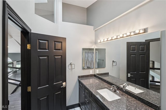 322 N Bayshore Dr Unit 3, Columbiana, OH 44408 - full bath featuring vanity, baseboards, and a high ceiling