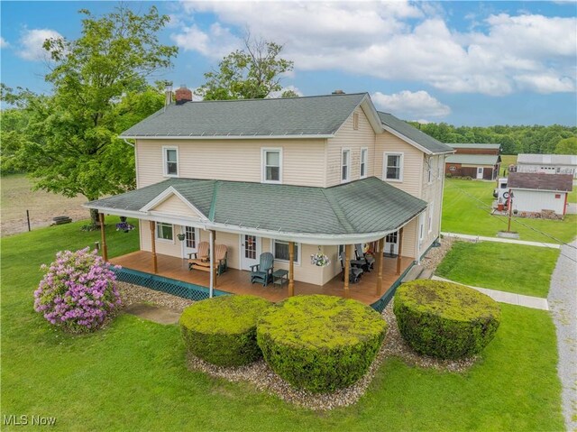 1731 State Route 225, Deerfield, OH 44411 - back of house featuring a chimney, covered porch, and a lawn