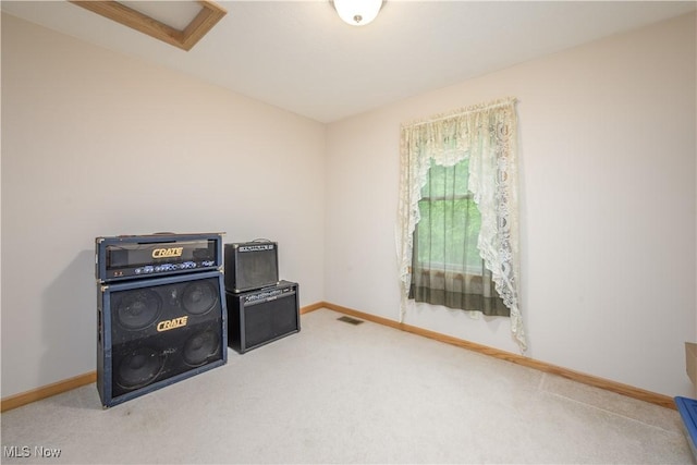 536 Silver Creek Dr, Doylestown, OH 44230 - spare room featuring carpet flooring, baseboards, and attic access
