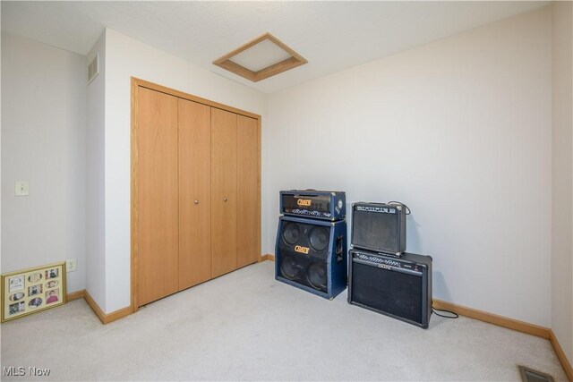 536 Silver Creek Dr, Doylestown, OH 44230 - carpeted bedroom with baseboards, attic access, and a closet