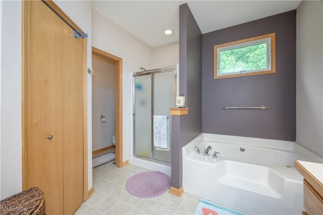 536 Silver Creek Dr, Doylestown, OH 44230 - bathroom with a stall shower, a garden tub, toilet, baseboards, and recessed lighting