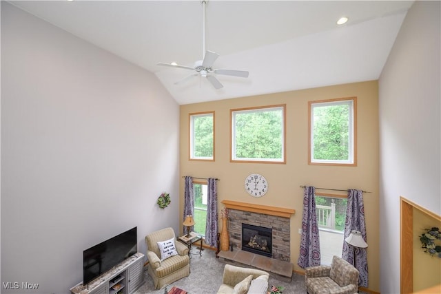 536 Silver Creek Dr, Doylestown, OH 44230 - living area with high vaulted ceiling, plenty of natural light, a ceiling fan, and a stone fireplace