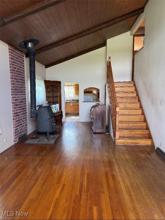 1517 Rolling Acres Rd, New Cumberland, WV 26047 - living room featuring a wood stove, wooden ceiling, wood finished floors, stairway, and baseboards