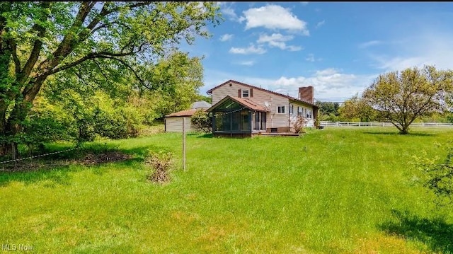1517 Rolling Acres Rd, New Cumberland, WV 26047 - back of property featuring a sunroom and a chimney