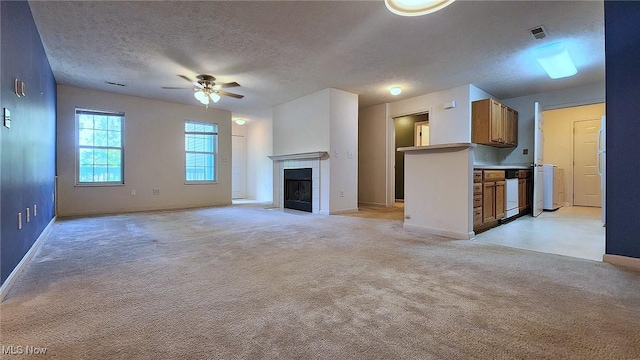 28360 Center Ridge Rd Unit 218, Westlake, OH 44145 - unfurnished living room with a textured ceiling, a ceiling fan, light colored carpet, baseboards, and a fireplace