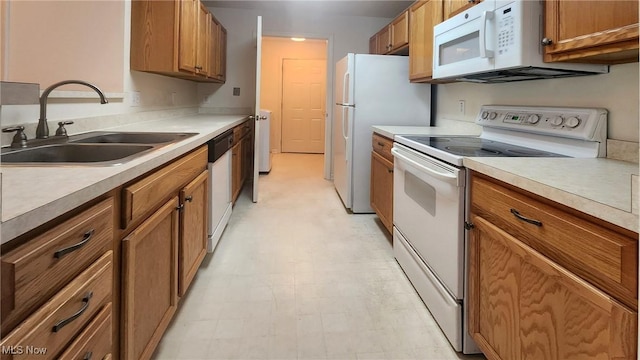 28360 Center Ridge Rd Unit 218, Westlake, OH 44145 - kitchen with white appliances, a sink, light flooring, brown cabinetry, and light countertops
