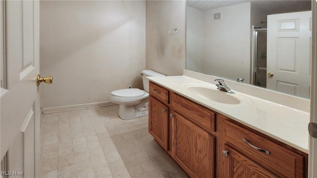 28360 Center Ridge Rd Unit 218, Westlake, OH 44145 - bathroom featuring vanity, toilet, an enclosed shower, baseboards, and tile patterned floors